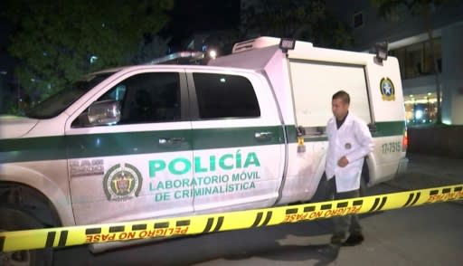 A police forensics van at the scene where a French defense systems engineer was shot dead in Bogota, Colombia