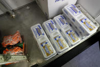 Carrots and eggs sit in a cooler at a local super market, Friday, May 29, 2020, in Des Moines, Iowa. As if trips to the grocery store weren't nerve-racking enough, shoppers lately have seen the costs of meat, eggs and even potatoes soar as the coronavirus has disrupted processing plants and distribution networks. (AP Photo/Charlie Neibergall)