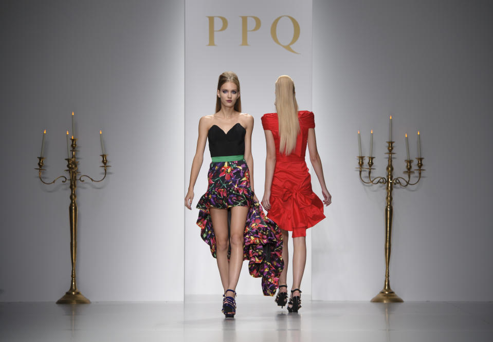 Models wear designs created by PPQ during London Fashion Week Spring/Summer 2014, at Somerset House in central London, Friday, Sept. 13, 2013. (Photo by Jonathan Short/Invision/AP)