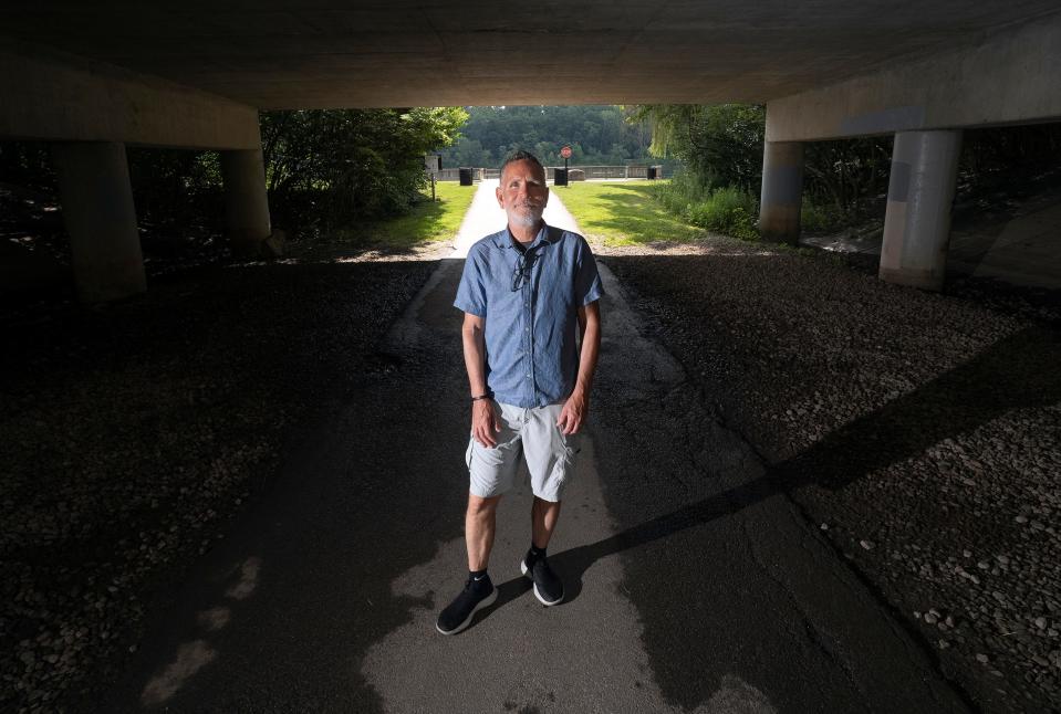 Darris Blackford, race director for the Columbus Marathon, stands near the entrance to the Antrim Park Loop trail. Blackford visits the loop often and was married on the dock nearby.