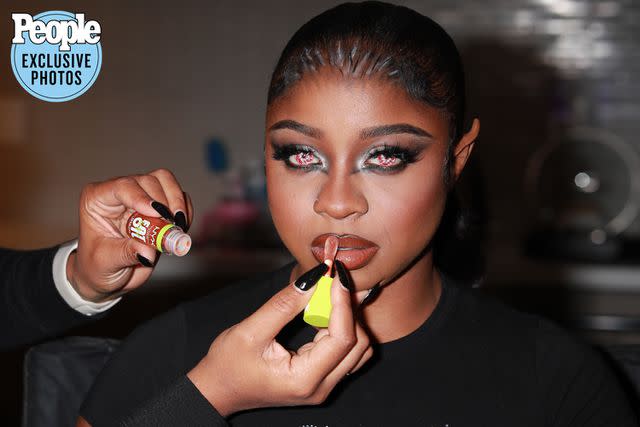 <p>Backgrid</p> Reginae Carter gets ready for the NYX Professional Makeup Mon-Stars Halloween bash