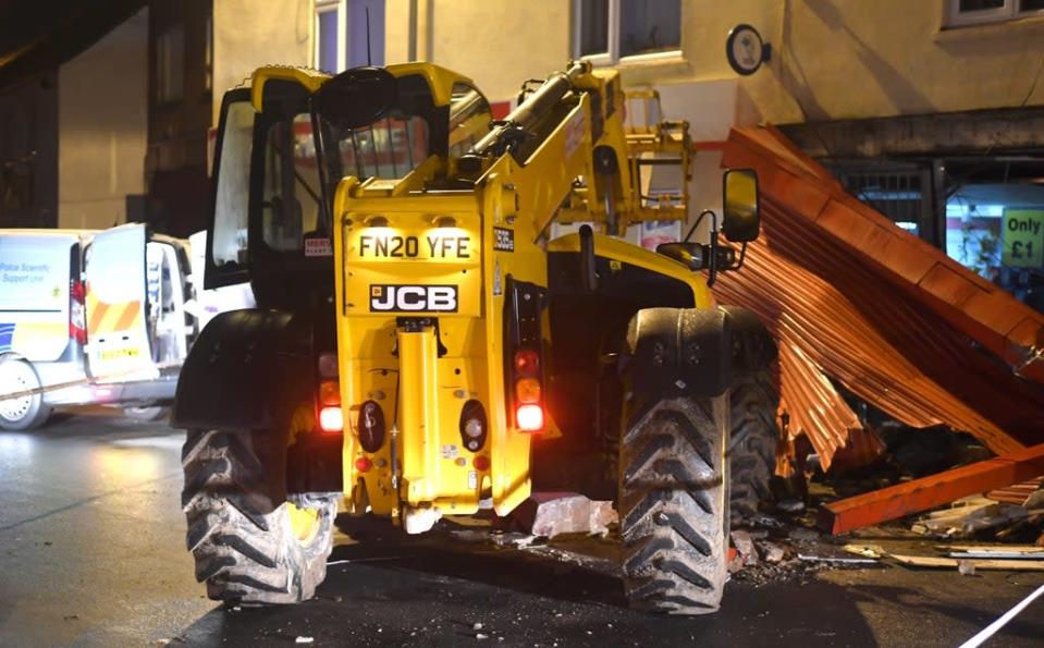 A JCB low loader outside Walsoken Post Office in Wisbech following a ram-raid in the early hours of this morning (Adam Fairbrother/PA) (PA Wire)