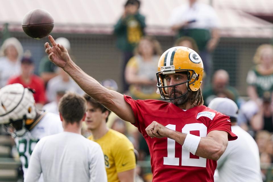 Green Bay Packers' Aaron Rodgers runs a drill at the NFL football team's practice field Wednesday, July 27, 2022, in Green Bay, Wis. (AP Photo/Morry Gash)