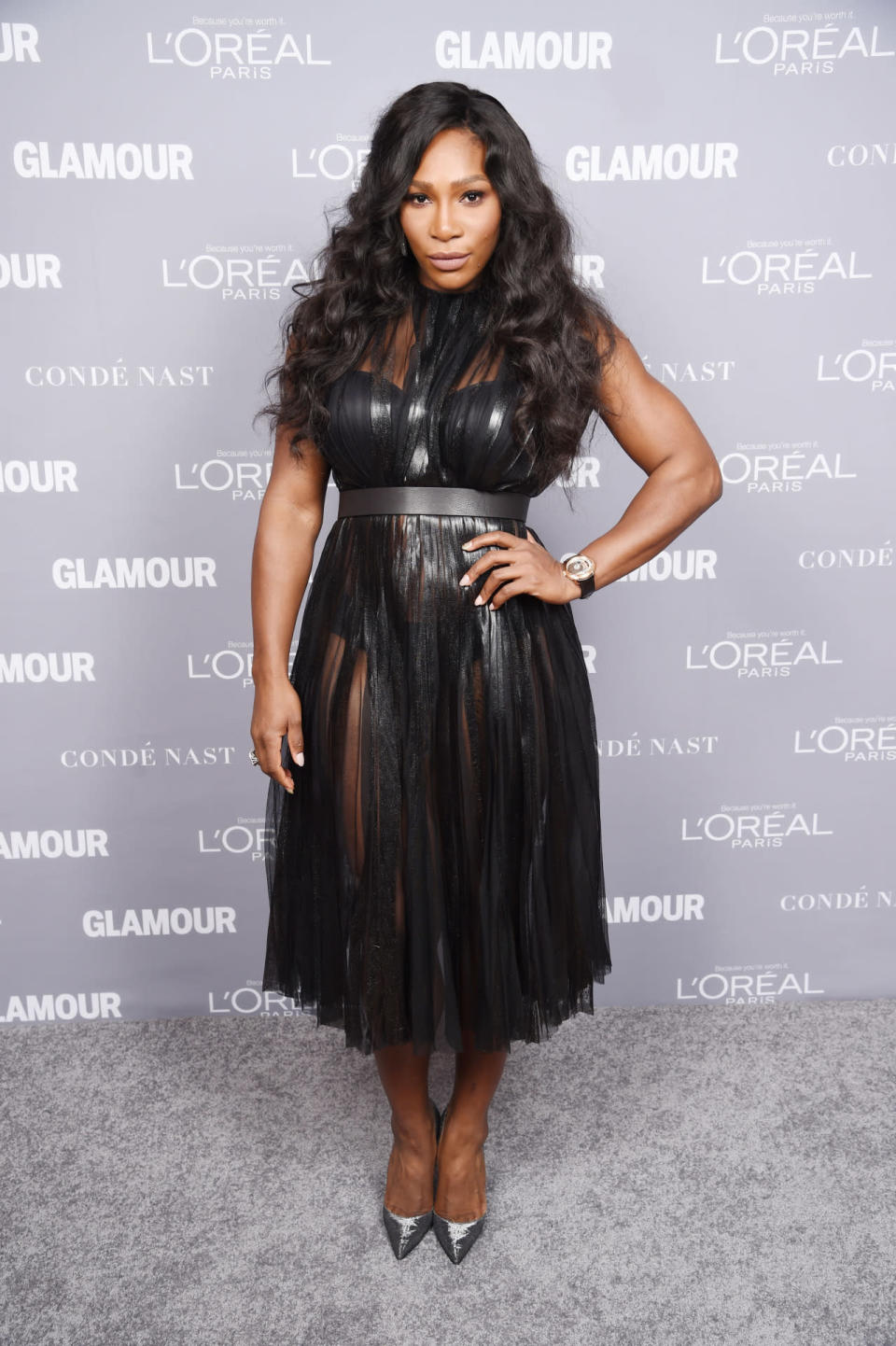 Serena Williams in a black sheer dress at the 2015 Glamour Women Of The Year Awards.