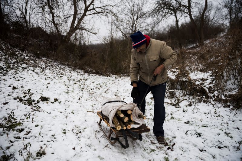 The Wider Image: Hungary's poor burn plastic bottles to stay warm, creating deadly smog