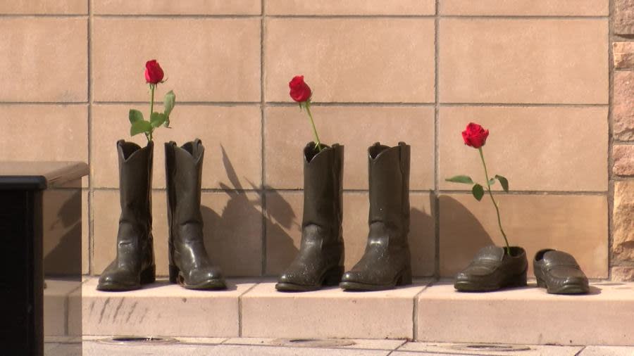 Red roses were placed in the brass boots and shoots of fallen Sedgwick County law enforcement officers, May 15, 2024. (KSN News Photo)