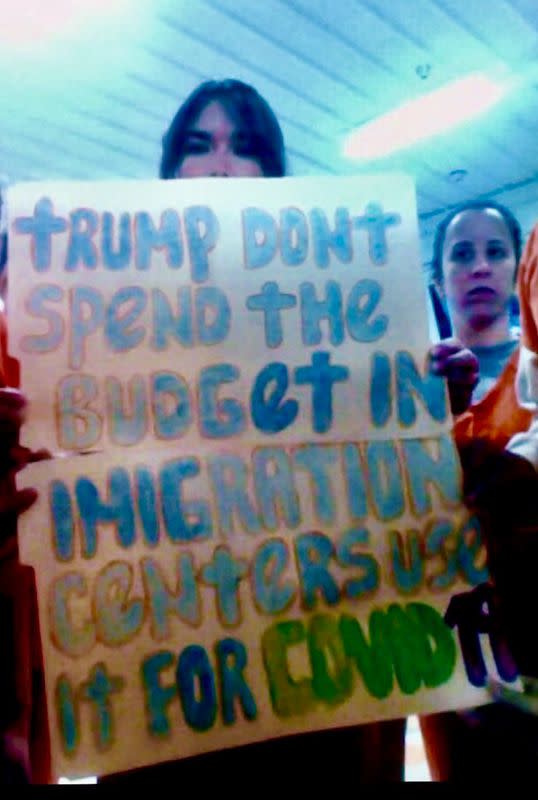 Migrants detained in an ICE detention facility in rural Louisiana display signs related to coronavirus disease