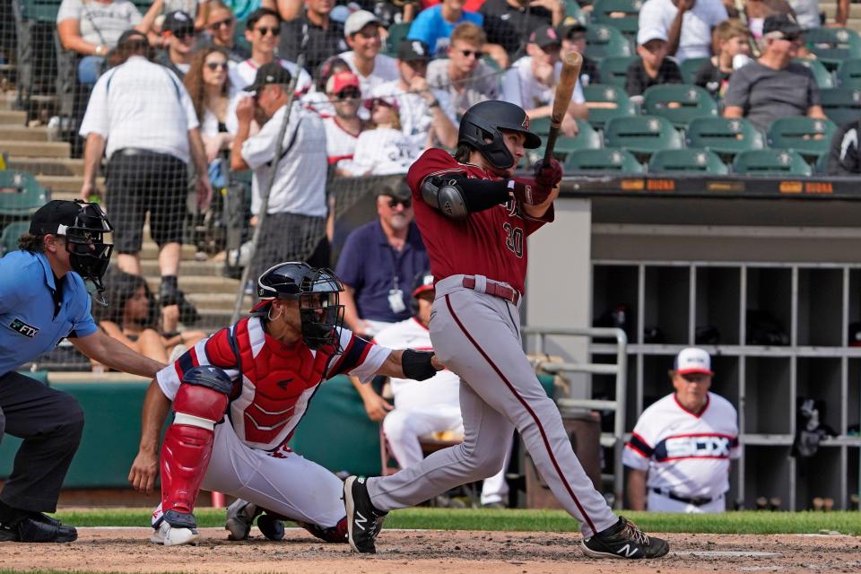 Aug 28, 2022; Chicago, Illinois, USA; Arizona Diamondbacks left fielder Jake McCarthy (30) hits a one run double against the Chicago White Sox during the ninth inning at Guaranteed Rate Field. Mandatory Credit: David Banks-USA TODAY Sports