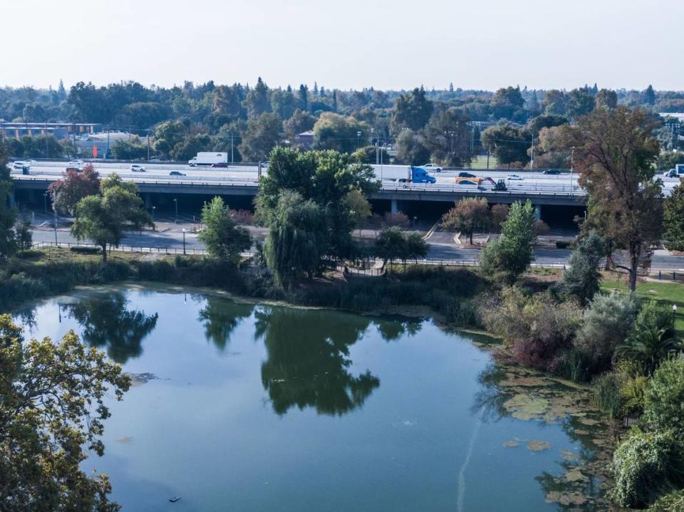 Traffic crosses the “Fix 50” construction zone on Highway 50 near Southside Park in Sacramento on Tuesday. The park and its lake were shortened to make way for the freeway and the extension of W Street in 1965. 