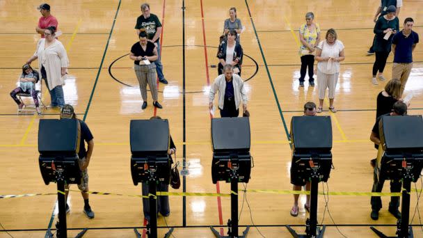 PHOTO: Voters cast their ballots in the Republican primary election pitting Rep. Liz Cheney against Harriet Hageman in Cheyenne, Wyo., Aug. 16, 2022. (Thomas Peipert/AP)