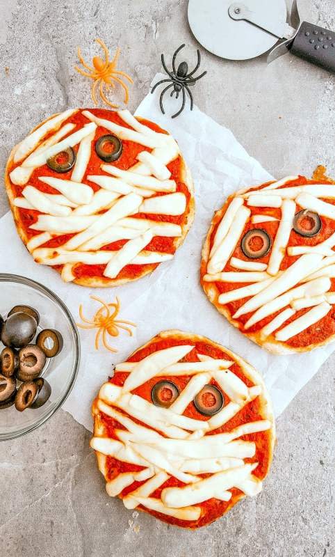 <p>Mommy Musings</p><p>Great for the family to do together, you can easily create mini mummy pizzas for each person and get into the spookiness of Halloween over a fun dinner or perfect for a snack. </p><p><strong>Get the recipe here: <a href="https://www.mommymusings.com/halloween-mini-mummy-pizzas-recipe/" rel="nofollow noopener" target="_blank" data-ylk="slk:Mummy Pizzas;elm:context_link;itc:0;sec:content-canvas" class="link rapid-noclick-resp">Mummy Pizzas</a></strong></p><p><strong>Related: <a href="https://parade.com/936879/juliajordan/best-food-and-drink-recipes-for-halloween-parties/" rel="nofollow noopener" target="_blank" data-ylk="slk:35+ Creepy-Cute Halloween Food and Drink Recipes;elm:context_link;itc:0;sec:content-canvas" class="link rapid-noclick-resp">35+ Creepy-Cute Halloween Food and Drink Recipes</a></strong></p>