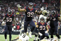 FILE - In this Nov. 29, 2015, file photo, Houston Texans defensive end J.J. Watt (99) leaps after sacking New Orleans Saints quarterback Drew Brees (9) during the third quarter of an NFL football game in Houston. J.J. Watt was selected to the 2010s NFL All-Decade Team announced Monday, April 6, 2020, by the NFL and the Pro Football Hall of Fame. (AP Photo/Eric Christian Smith, File)