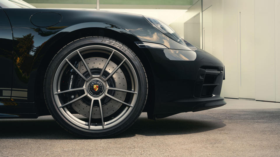 Black brake calipers accent the platinum-colored rims of the 20- and 21-inch 911 Turbo S wheels (front and back, respectively). - Credit: Photo: Courtesy of Porsche Design.