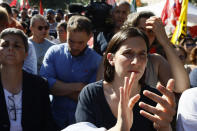 Italian Democratic party leader Elly Schlein participates in a rally with members of the Indian community in Italy protesting in Latina, some 60 kilometers south of Rome, Saturday, June 22, 2024, to ask for justice for Satnam Singh, an Indian laborer, bled to death after his arm got stuck in a nylon-wrapping machine and was wrenched off. Police on Tuesday arrested Antonello Lovato, a farm owner on suspicion of homicide after he allegedly refused entreaties by Singh's wife, who also worked at the farm, to call an ambulance, claiming he was already dead. (Cecilia Fabiano/LaPresse via AP)