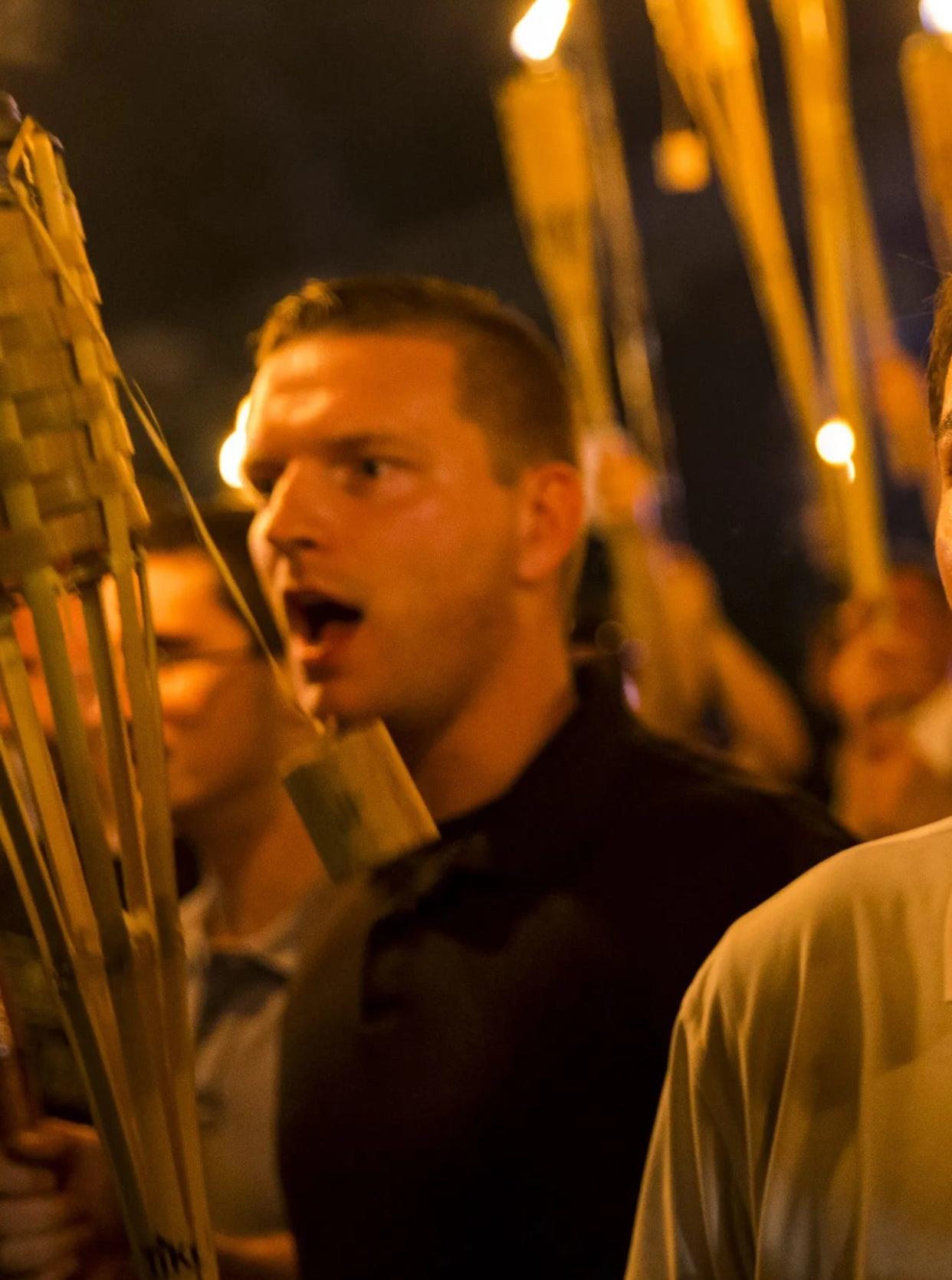 Ted Von Nukem, in black, was identified by a former classmate as one of the people in a viral photo from a rally of neo-Nazis, white supremacists and alt-right protesters on Aug. 11, 2017, in Charlottesville.