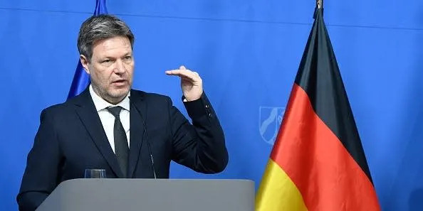 German Economic Affairs Minister Robert Habeck with a Germany flag in the background