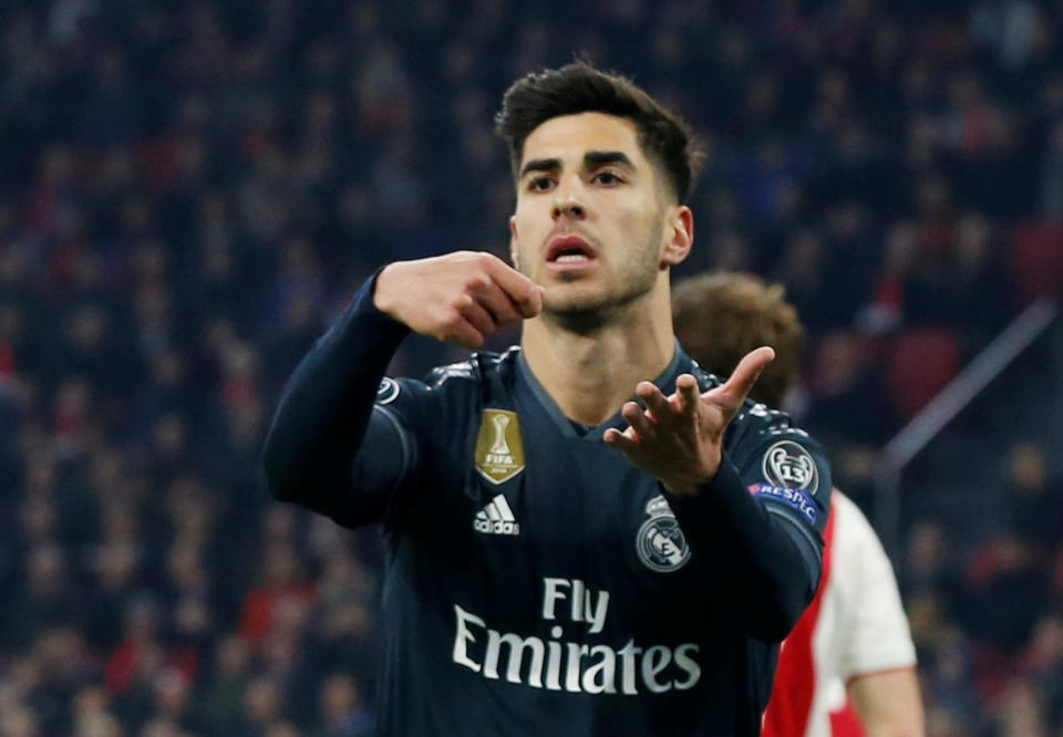 Marco Asensio celebrates after scoring the winner for Real Madrid against Ajax. (Reuters)
