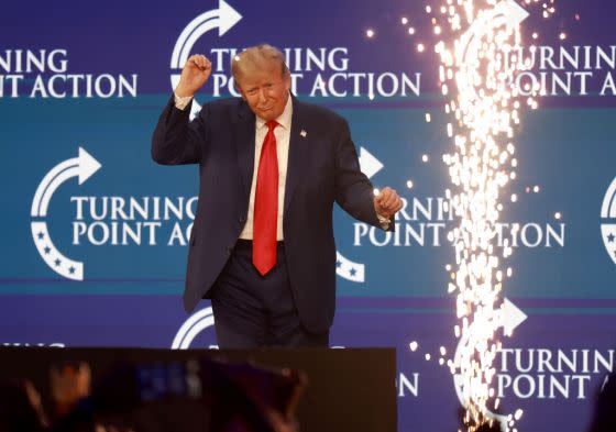 Former President Donald Trump briefly dances after speaking at the Turning Point Action conference on July 15, 2023, in West Palm Beach, Florida. (Photo by Joe Raedle/Getty Images)