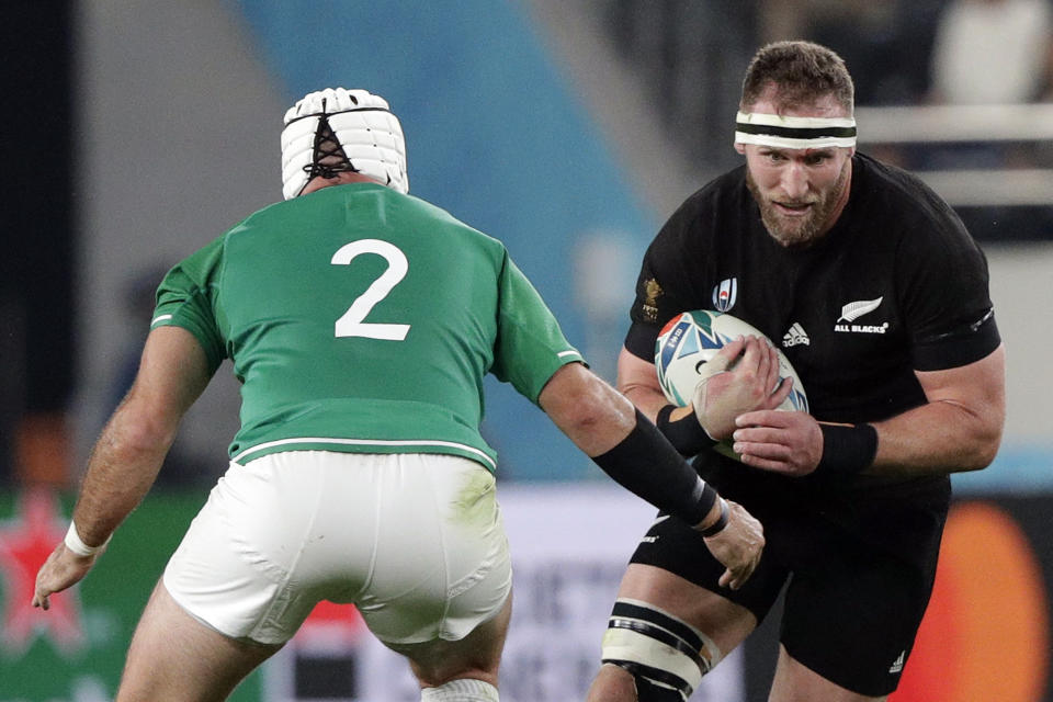 New Zealand's Kieran Read, right, evades Ireland's Rory Best during the Rugby World Cup quarterfinal match at Tokyo Stadium between New Zealand and Ireland in Tokyo, Japan, Saturday, Oct. 19, 2019. (AP Photo/Mark Baker)