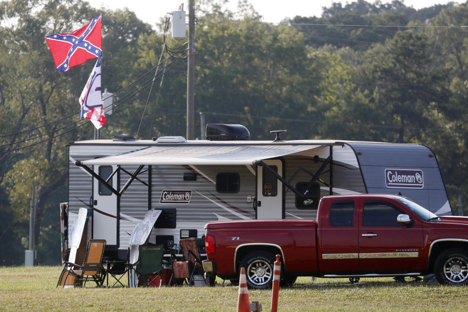 A camper displays Confederate Battle flag in a campground across from the Speedway during the NASCAR Xfinity auto race at the Talladega Superspeedway in Talladega Ala., Saturday June 20, 2020 (AP Photo/John Bazemore)