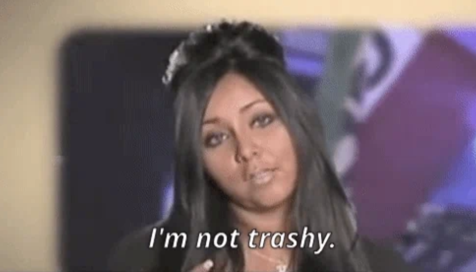 Snooki from Jersey Shore looks at the camera with the caption "I'm not trashy" displayed at the bottom of the image