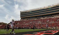 LUBBOCK, TX - NOVEMBER 12: Josh Stewart #5 of the Oklahoma State Cowboys runs for a touchdown against the Texas Tech Red Raiders at Jones AT&T Stadium on November 12, 2011 in Lubbock, Texas. (Photo by Ronald Martinez/Getty Images)