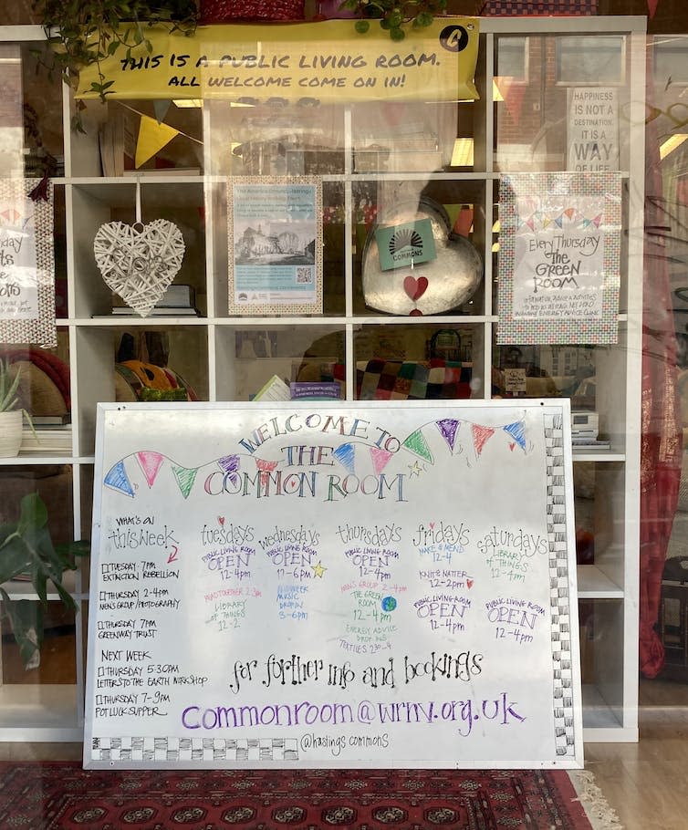 A window of a community project in Hastings called the Common Room showing events and groups for local people to join.