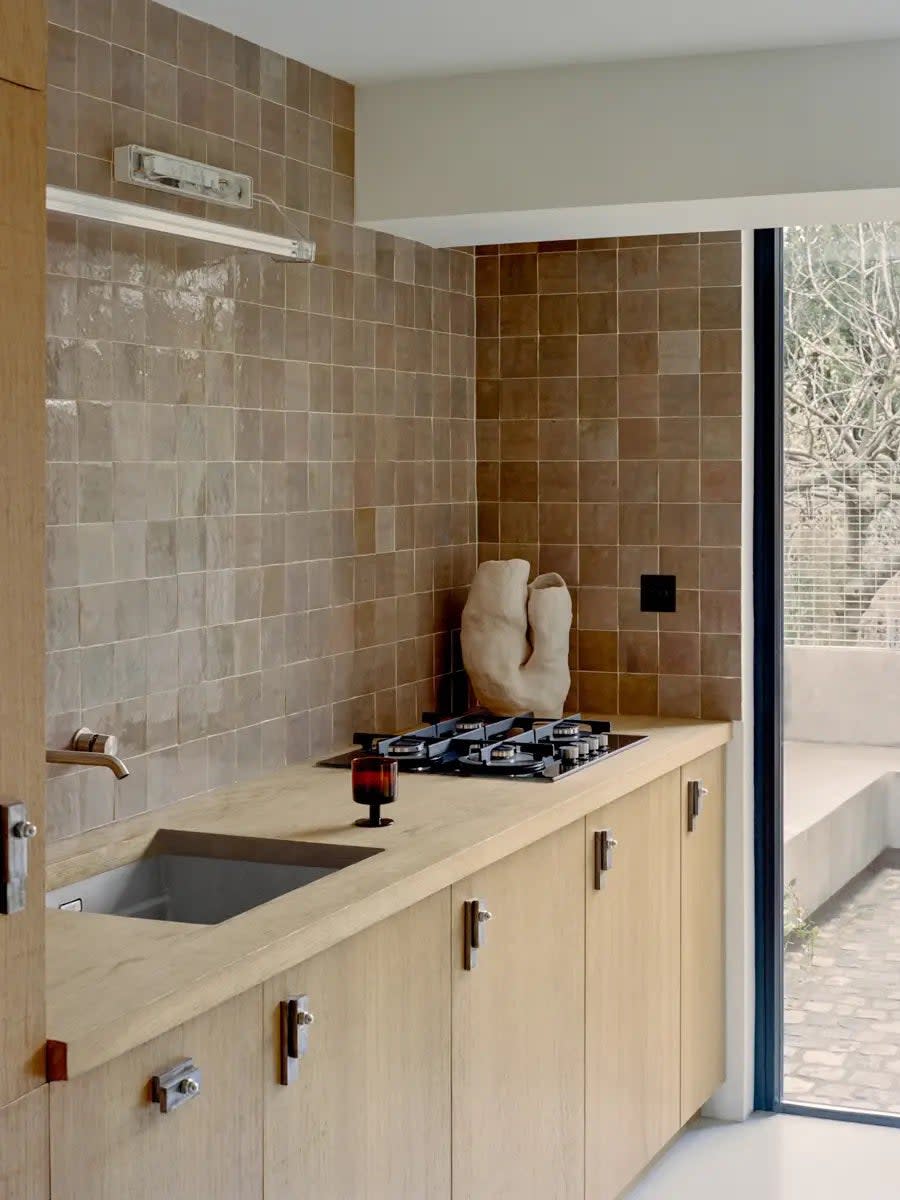 wood cabinets with zellige tiles