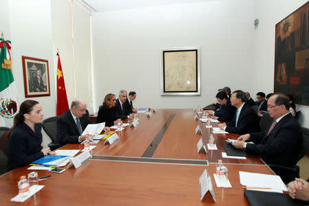 Mexico's Foreign Minister Claudia Ruiz Massieu (3rd L) and Chinese State Councilor Yang Jiechi (2nd R) attend a private meeting at the foreign ministry building (SRE), in Mexico City in this undated handout photo released to Reuters by the Mexican Foreign Ministry office on December 12, 2016. Mexico's Foreign Ministry office/Handout via REUTERS