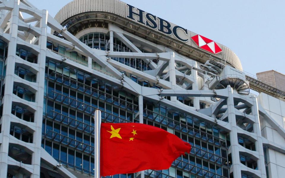 A Chinese national flag flies in front of HSBC headquarters in Hong Kong, China - REUTERS/Tyrone Siu/File Photo