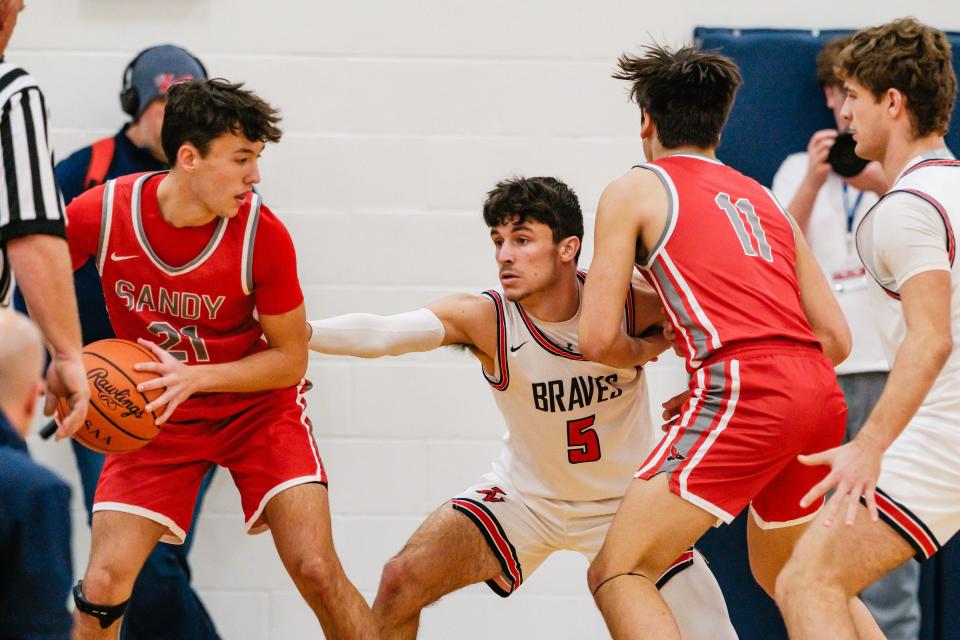 Indian Valley's Tanyon McComb gaurds Sandy Valley's Dantae Faiello, Tuesday, Dec. 12 in Gnadenhutten.