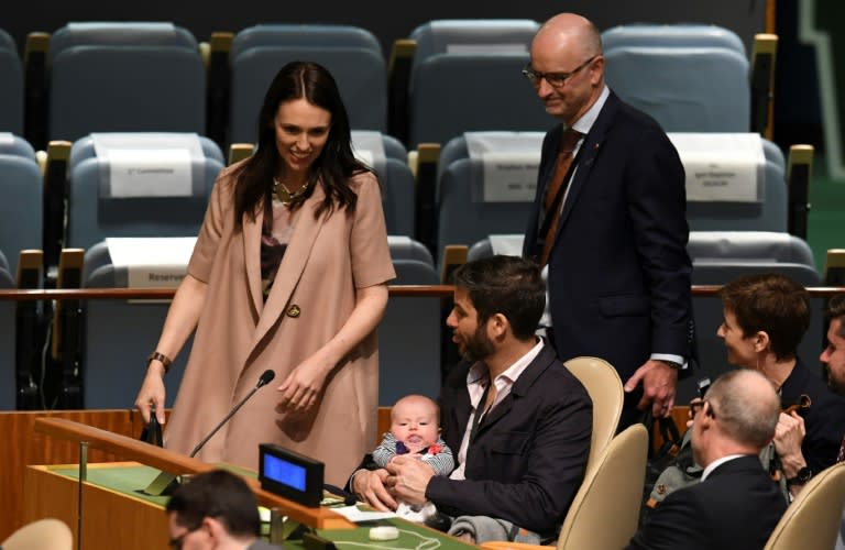 New Zealand Prime Minister Jacinda Ardern, left, has made history by bringing her baby to the United Nations General Assembly, here held by her partner Clarke Gayford