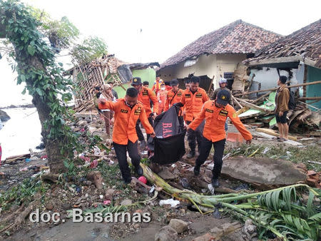 Rescuers work after a tsunami hit Lampung province, Indonesia, December 24, 2018, in this picture obtained from social media. Basarnas/via REUTERS