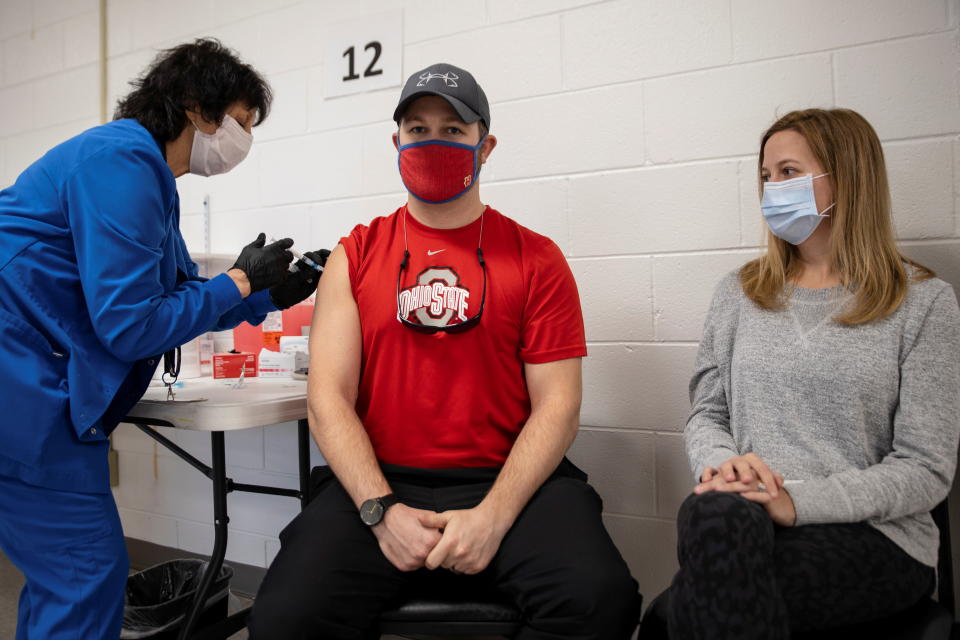 Jake Lawler, 29, receives his coronavirus disease (COVID-19) vaccine as vaccine eligibility expands to anyone over the age of 16 at the Bradfield Community Center through Health Partners of Western Ohio in Lima, Ohio, U.S., March 29, 2021.  REUTERS/Megan Jelinger     TPX IMAGES OF THE DAY