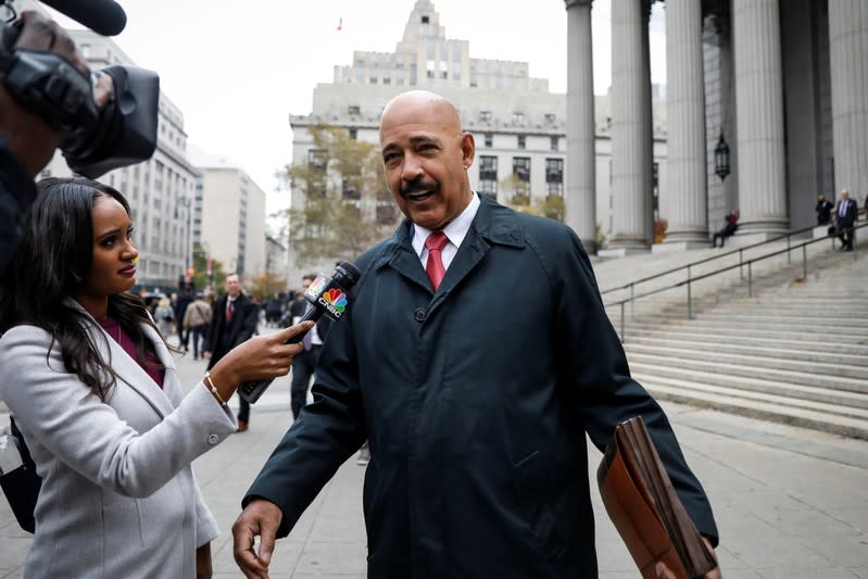 Theodore Wells, the lawyer for Exxon, speaks to a reporter after exiting New York State Supreme Court in New York