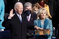 <p><a href="https://people.com/style/jill-biden-inauguration-day-2021-dress-coat/" rel="nofollow noopener" target="_blank" data-ylk="slk:Jill Biden;elm:context_link;itc:0;sec:content-canvas" class="link ">Jill Biden</a> holds the Bible as Joe Biden is sworn in as the 46th President of the United States. </p>