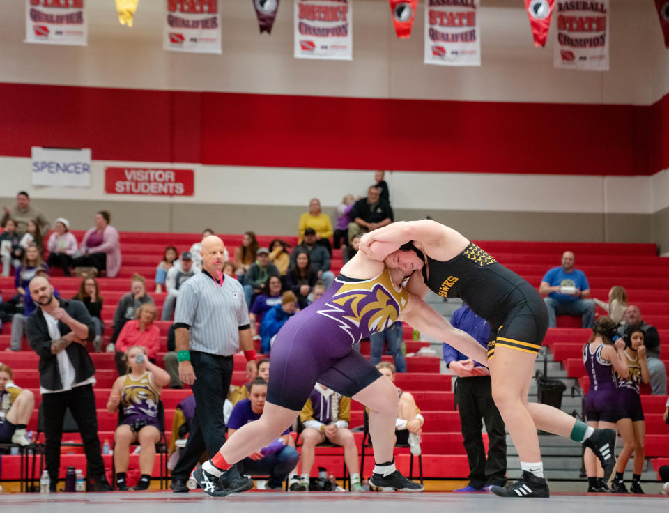 Alexis Johnson of Waverly-Shell Rock wrestles Kayleen Nachtigal of Spencer at 190 pounds during the first sanctioned girls wrestling dual in Iowa history Monday at Dallas Center-Grimes.