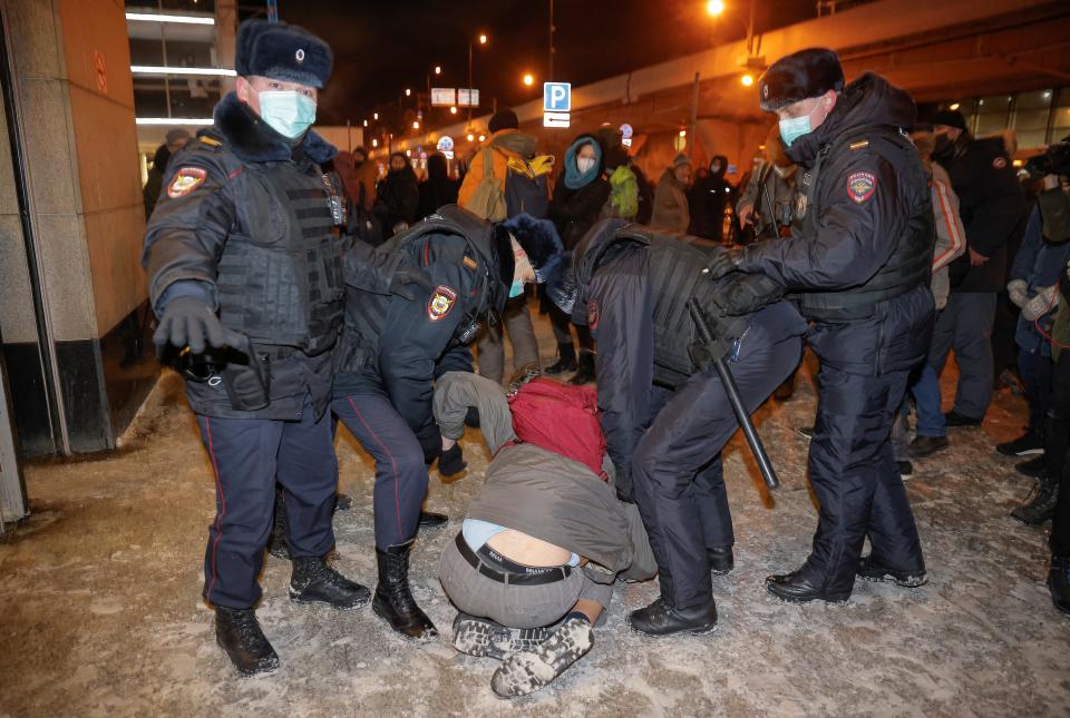 Law enforcement officers detain a man before the expected arrival of Russian opposition leader Alexei Navalny on a flightREUTERS