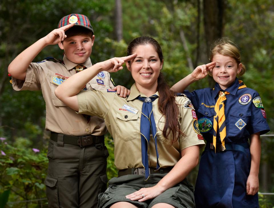 Den leader Candice Young (center) with her son Gavin, 9, a Webelo Cub Scout, and her daughter Mary, 7, a Wolf Cub, the first girl to sign up for a North Florida Council pack since the national organization began accepting girls into the Cub program in June 2018. Mary had been in Girl Scouts, but with her brother a Cub Scout and their mother a den leader, she tagged along to many Boy Scout activities.