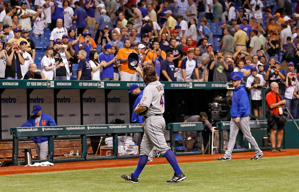 ST PETERSBURG, FL - JUNE 13: Pitcher R.A. Dickey #43 of the New York Mets tips his hat to the crowd after his one hit complete game against the Tampa Bay Rays at Tropicana Field on June 13, 2012 in St. Petersburg, Florida. (Photo by J. Meric/Getty Images)