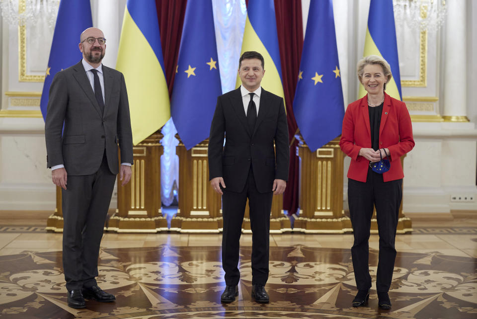 Ukrainian President Volodymyr Zelenskyy, center, European Commission President Ursula von der Leyen, right, and European Council President Charles Michel pose for a group photo on the occasion of a Ukraine EU summit in Kyiv, Ukraine, Tuesday, Oct. 12, 2021. The 23rd summit between the European Union and Ukraine is held in Kyiv. (Ukrainian Presidential Press Office via AP)