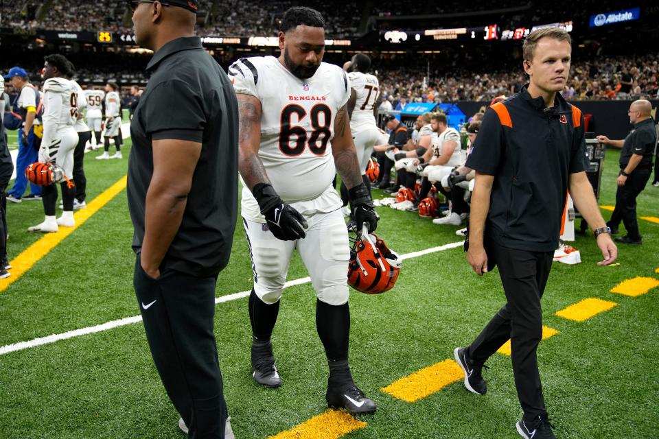 Cincinnati Bengals defensive tackle Josh Tupou (68) walks to the locker room after suffering an injury to his calf Sunday against New Orleans.