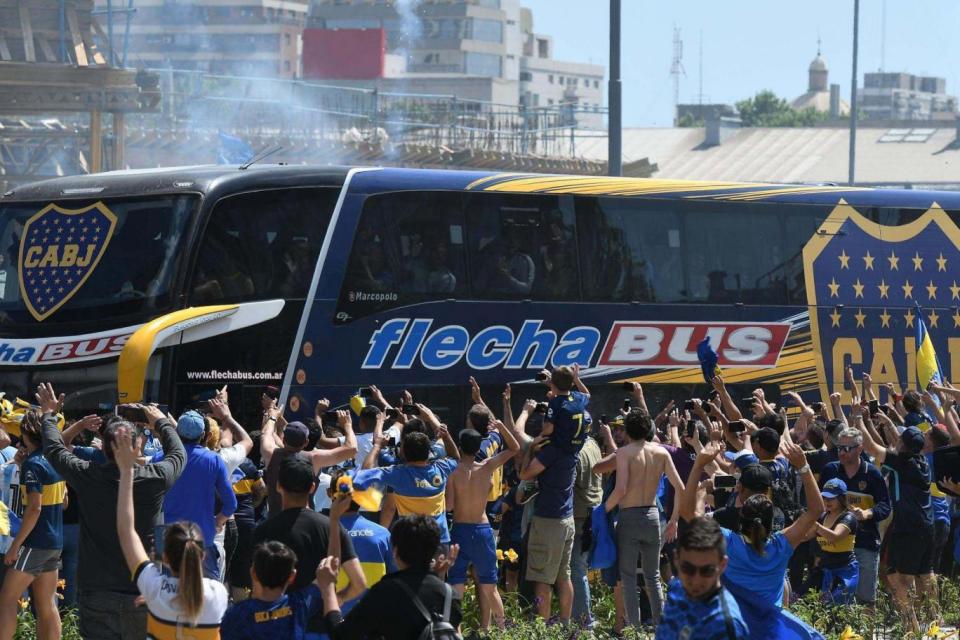 Picture released by Telam showing fans greeting Boca Juniors players as their bus leaves their hotel (AFP/Getty Images)