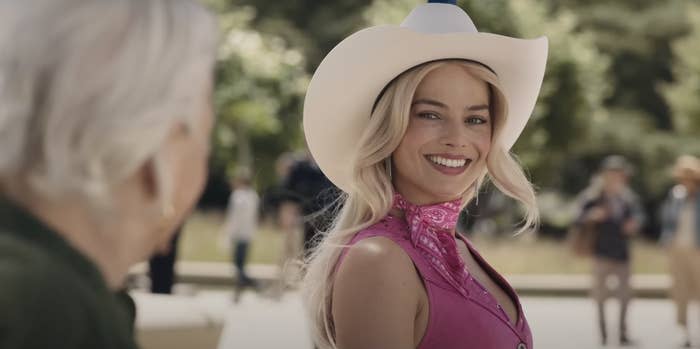 Margot Robbie as Barbie wearing a cowboy hat in "Barbie"