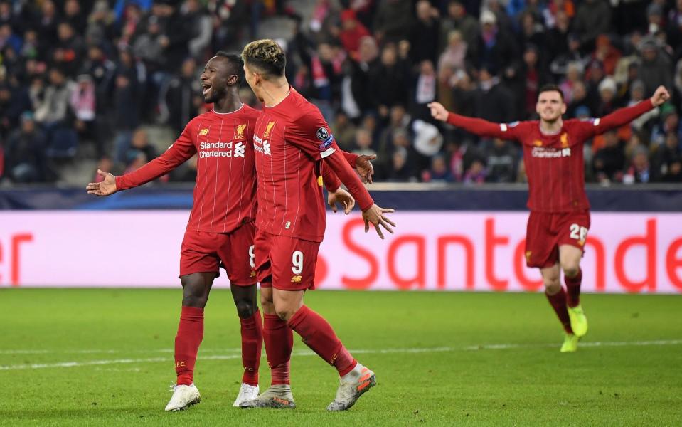  Naby Keita of Liverpool celebrates with Roberto Firmino after he scores his team's first goal during the UEFA Champions League group E match between RB Salzburg and Liverpool - Getty Images Europe