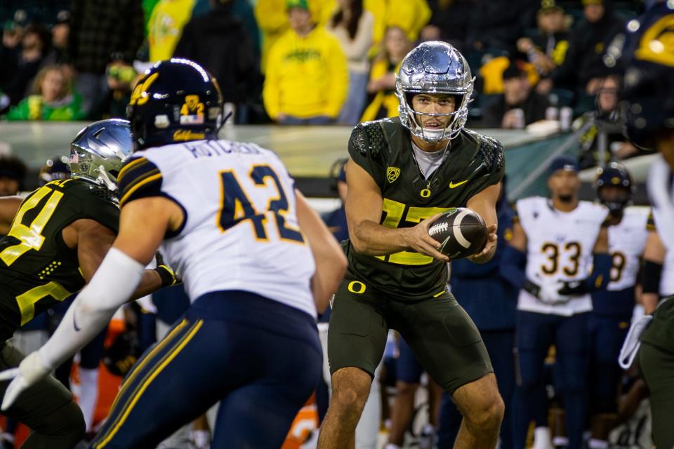 Oregon quarterback Ty Thompson takes a snap as the No. 6 Oregon Ducks host California Saturday, Nov. 4, 2023, at Autzen Stadium in Eugene, Ore.