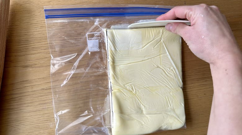 shaping butter in plastic bag