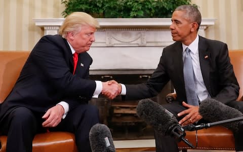 President Barack Obama and President-elect Donald Trump shake hands following their meeting in the Oval Office of the White House in Washington, Thursday, Nov. 10, 2016 - Credit: AP