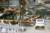 Debris are seen on a residential area hit by heavy rain in Kumamura, Kumamoto prefecture, southern Japan Tuesday, July 7, 2020. Rescue operations continued and rain threatened wider areas of the main island of Kyushu. (Kota Endo/Kyodo News via AP)