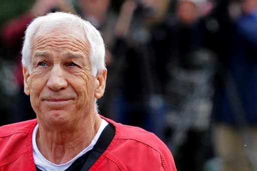 Former Penn State assistant football coach Jerry Sandusky walks into the Centre County Courthouse before being sentenced in his child sex abuse case in Bellefonte, Pennsylvania. Sandusky was sentenced Tuesday to between 30 and 60 years in prison in a high-profile child sex case that shocked the country